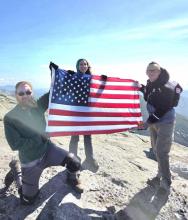 Us on the peak with the flag